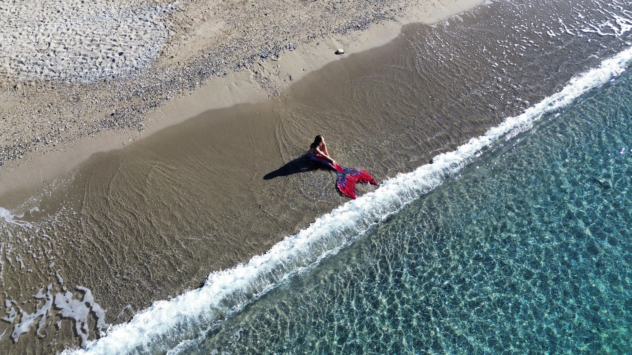 Mermaiding sitting on Beach